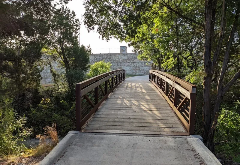 Deerbrooke walking trail wooden footbridge in Leander Texas service area